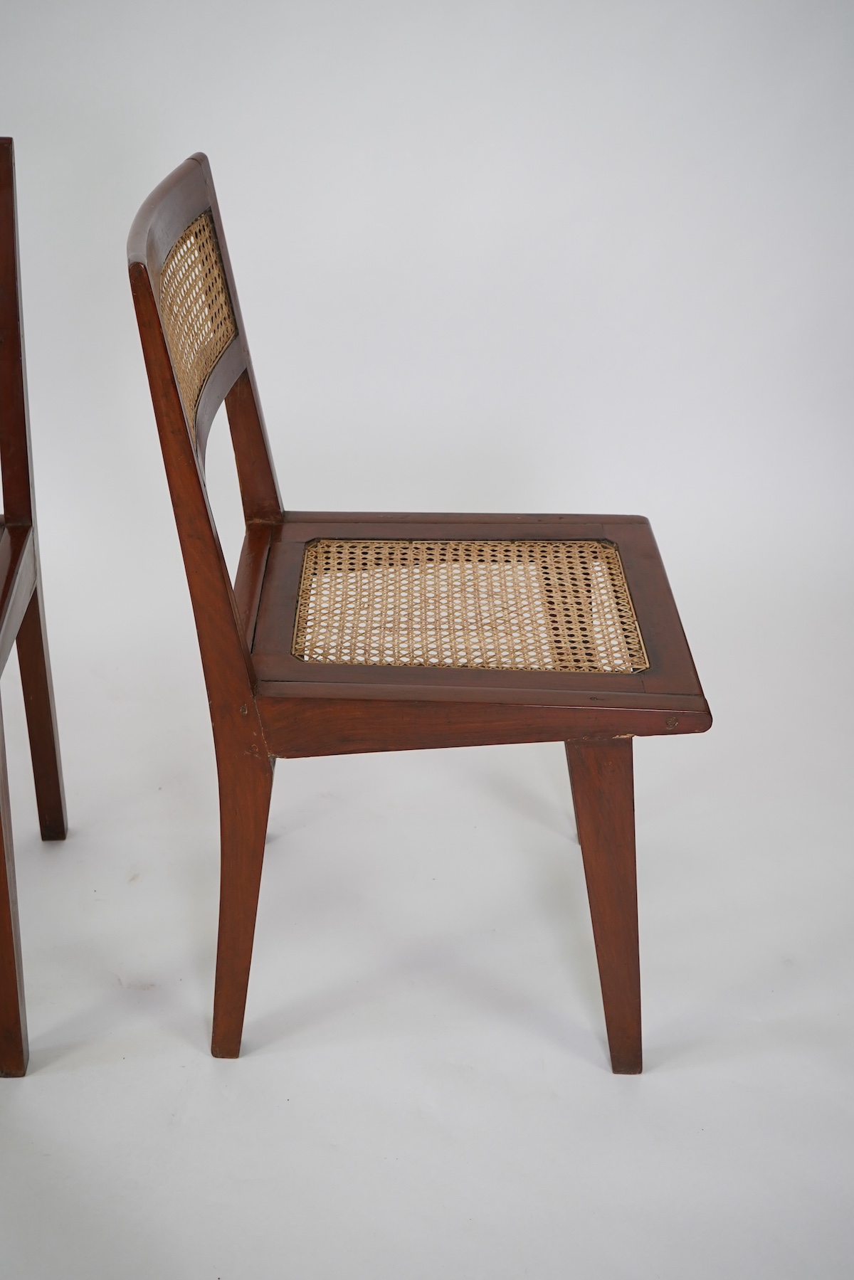 Pierre Jeanneret (Swiss, 1896-1967) for Chandigarh: A set of four solid solid teak and braided canework chairs PJ-010501